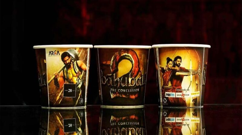 paper cup with bahubali poster print on it